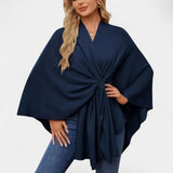 Daniela – Elegants pončo ar maigu kritumu un loku